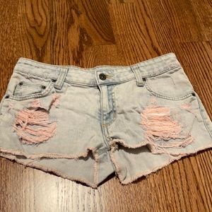Low cut carman cutoff Jean shorts with pink bleach